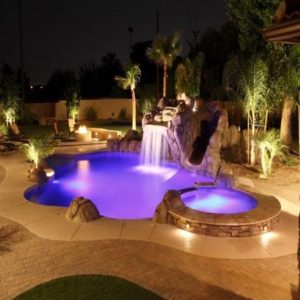 A pool with beautiful violet light at night